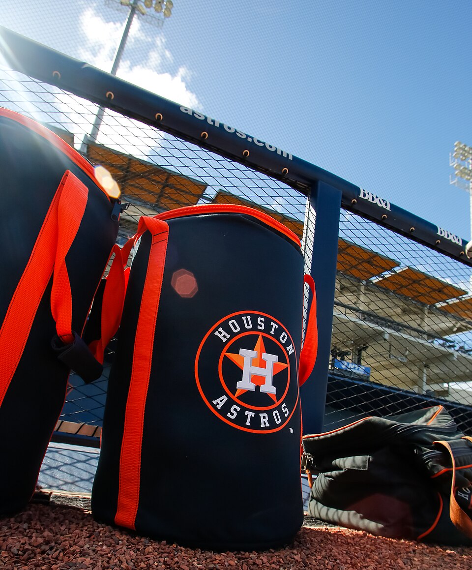 Houston Astros spring training equipment bags near the dugout at CACTI Park.