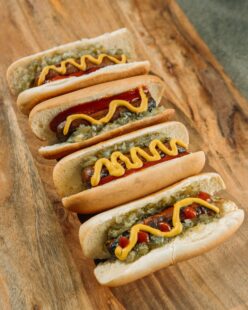 Variety of hot dogs at a baseball game.