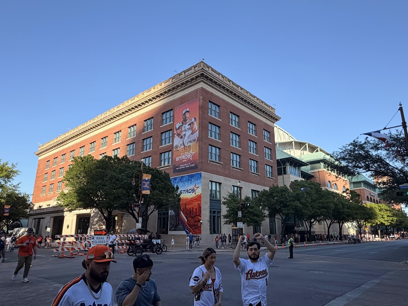 Astros fans walk in front of Daikin Park on Opening Day.