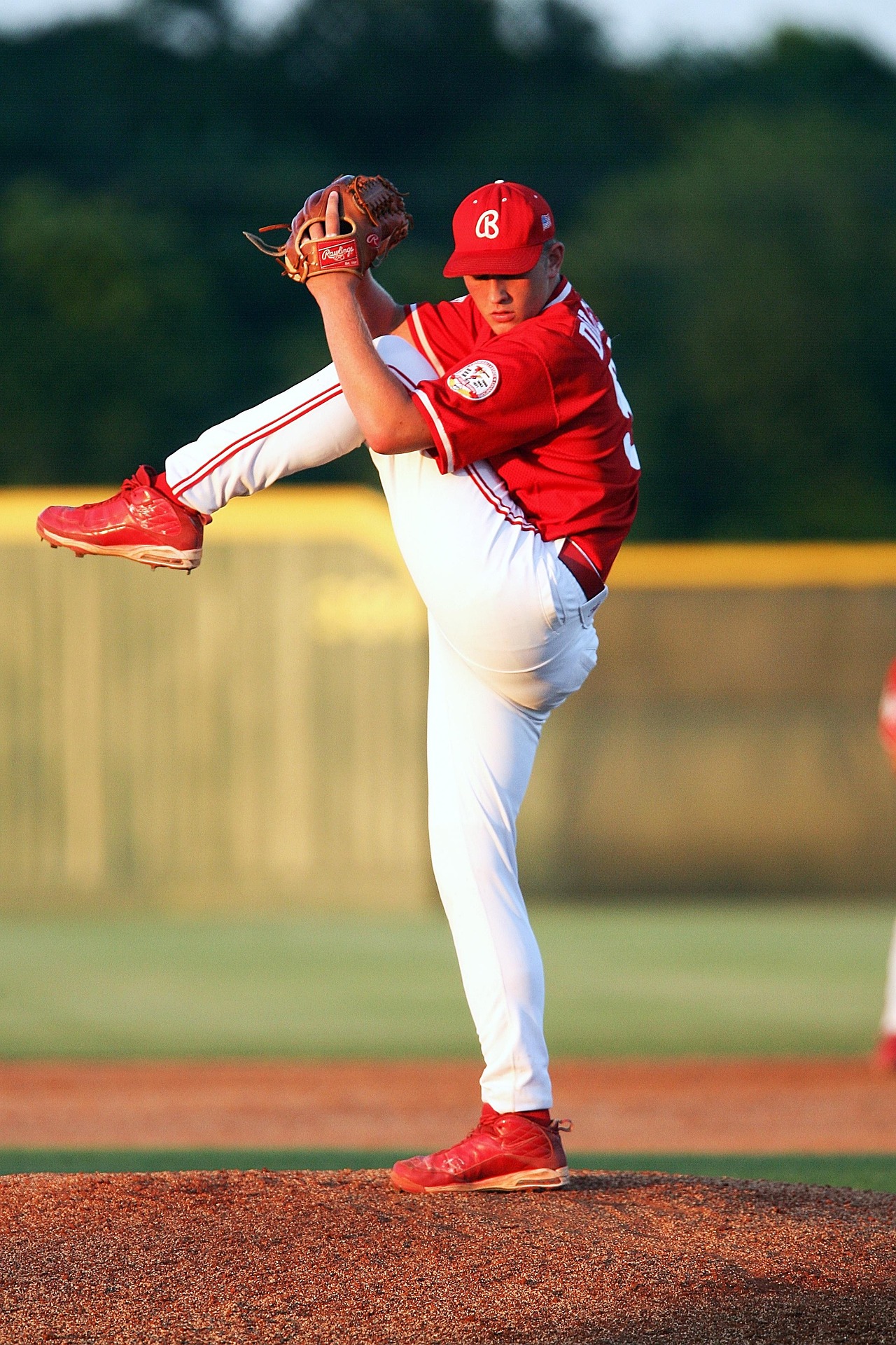 A baseball pitcher delivering a pitch during a game.