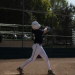 A batter is practicing his swing.