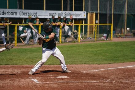 A baseball player at the plate, waiting for the right pitch.