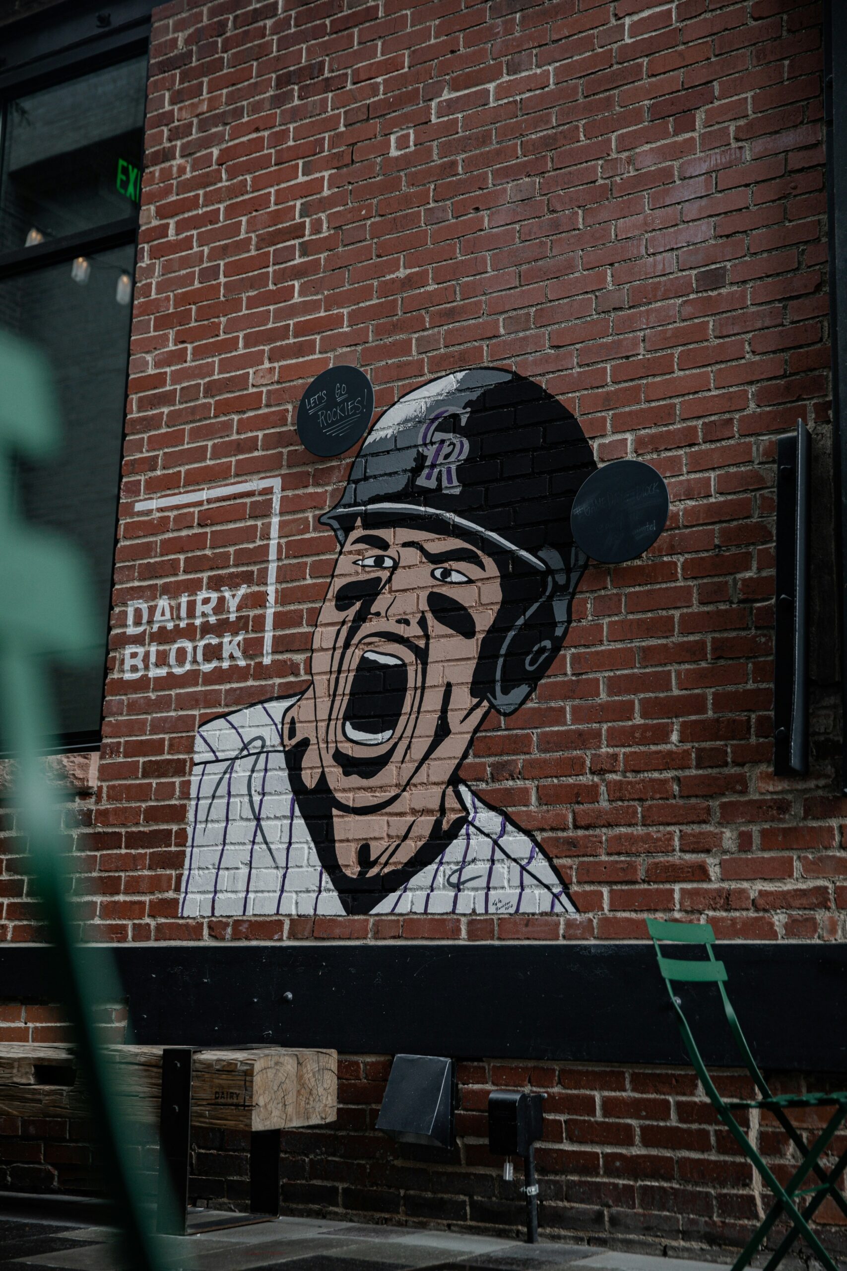 A mural depicts a player for the Colorado Rockies baseball team.