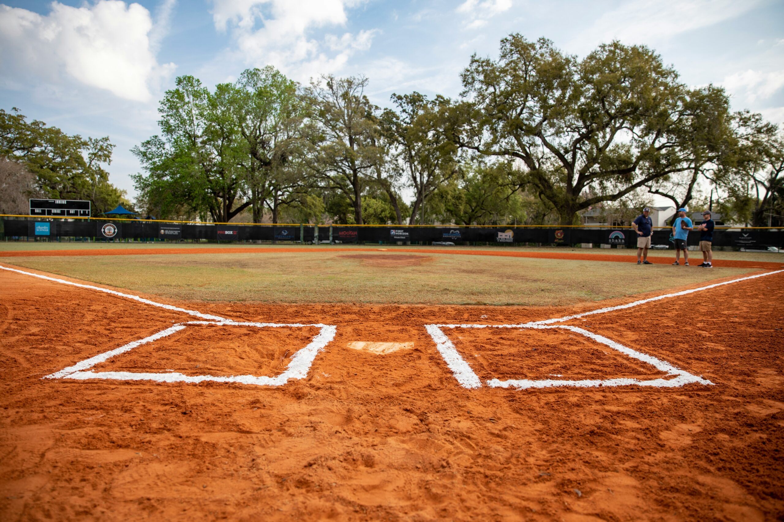 An empty baseball diamond sprawls in the distance.