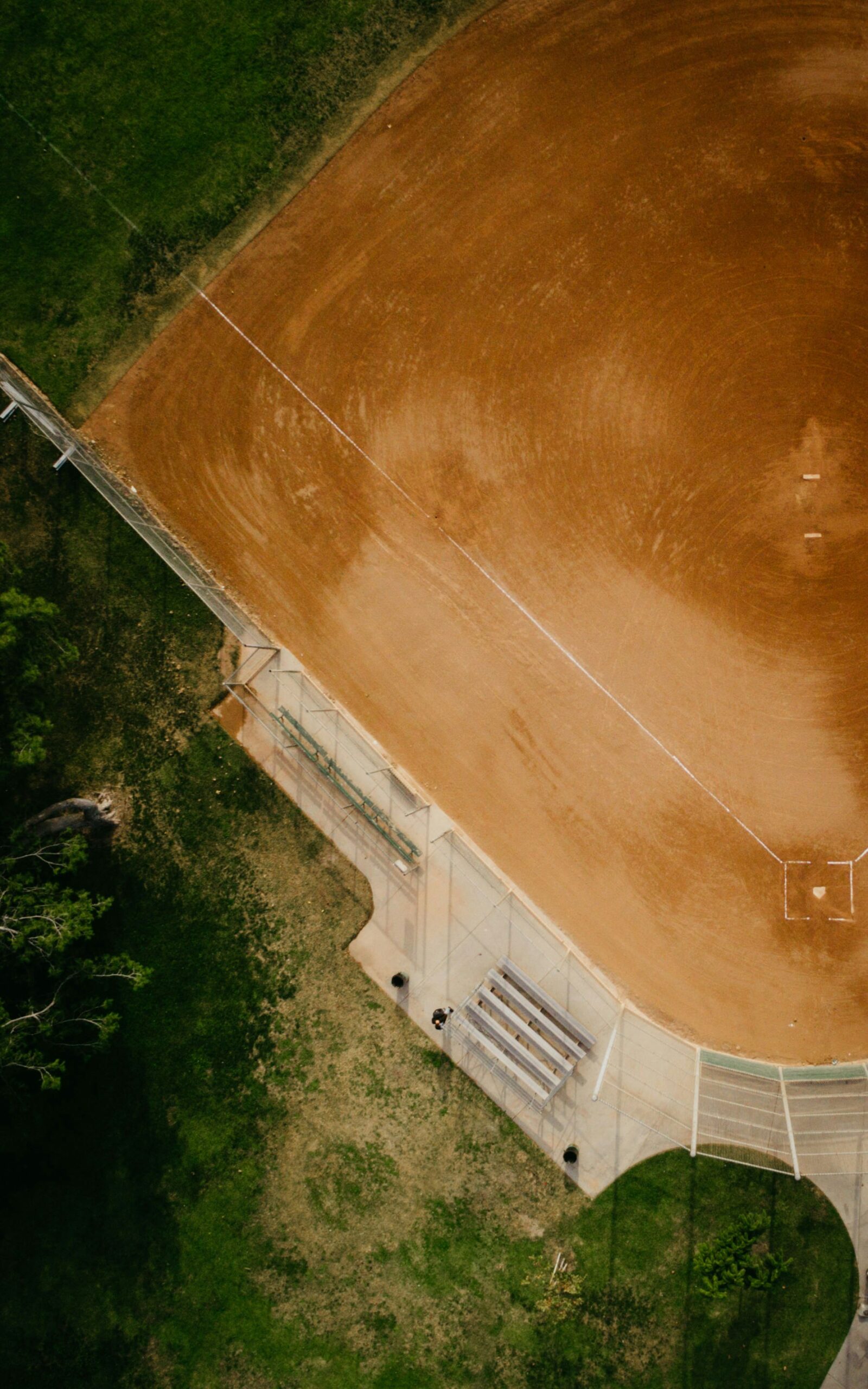 An image of half of an empty baseball diamond.