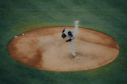 A pitcher takes the mound, ready for the baseball game.