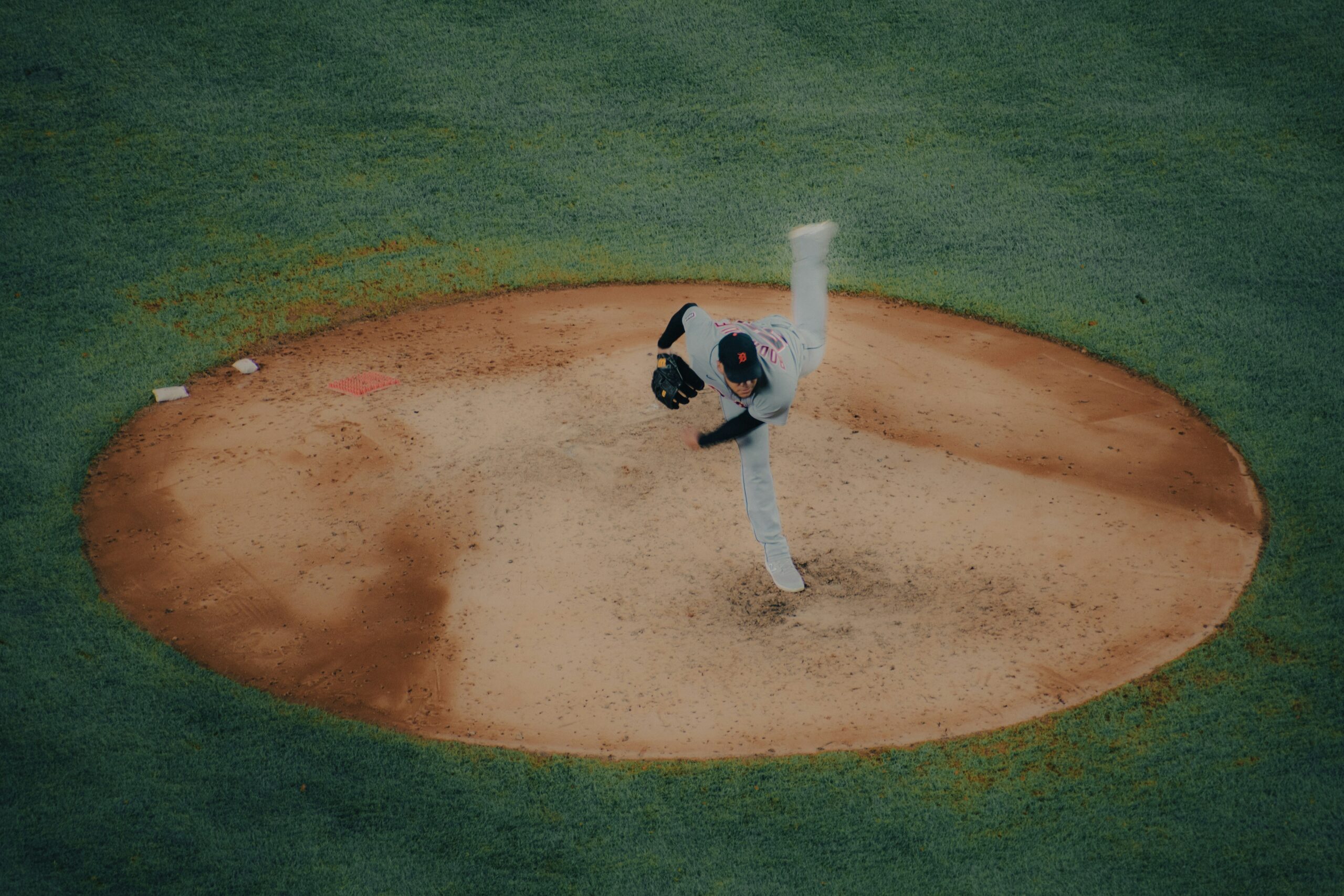 A pitcher takes the mound, ready for the baseball game.