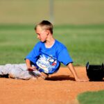 A baseball player slides into base.
