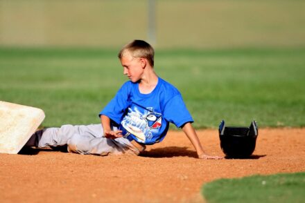 A baseball player slides into base.