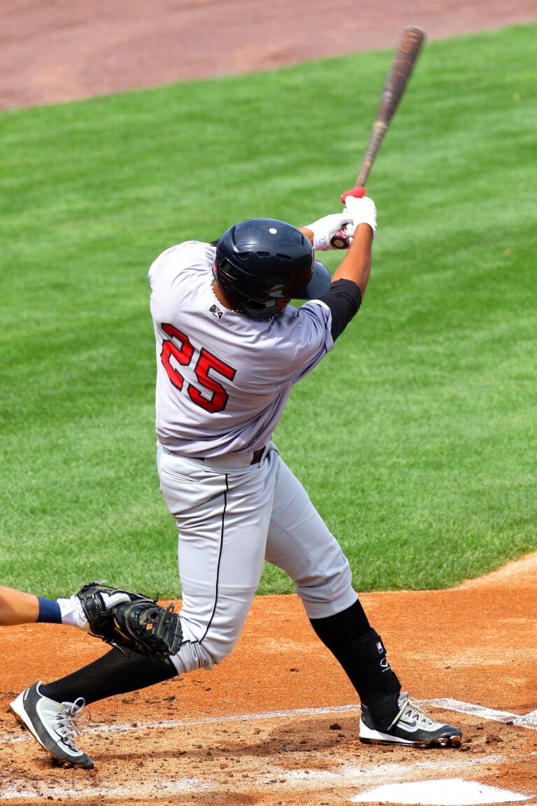 A batter swings away at home plate.