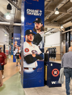 A banner at Daikin Park with the Astros' 2026 slogan, "Chase the Fight", on it.
