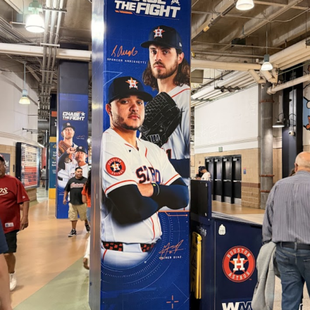 A banner at Daikin Park with the Astros' 2026 slogan, "Chase the Fight", on it.