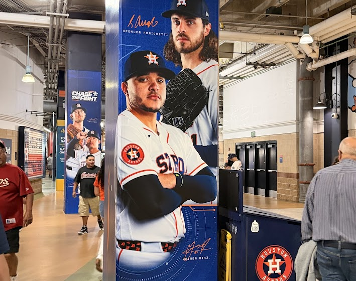 A banner at Daikin Park with the Astros' 2026 slogan, "Chase the Fight", on it.