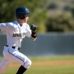 A baseball player running on a baseball field.