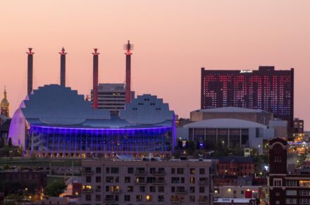 Kauffman Stadium, where the Royals play, stands out against the skyline at dusk.