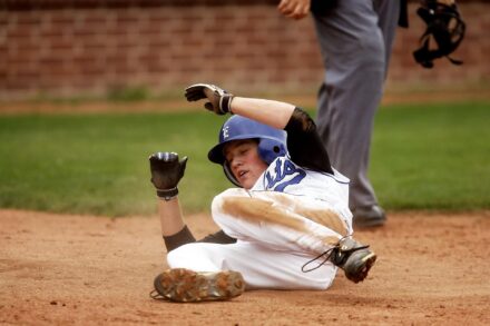 A baseball player slides into base.