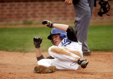 A baseball player slides into base.