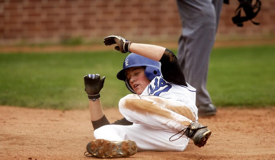 A baseball player slides into base.