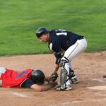 A runner is tagged out at the base.