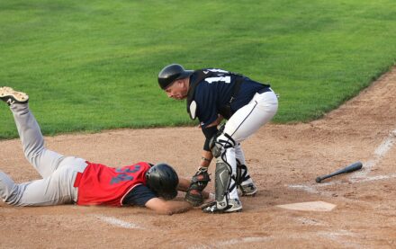 A runner is tagged out at the base.