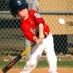 A batter is at home plate, ready to swing.