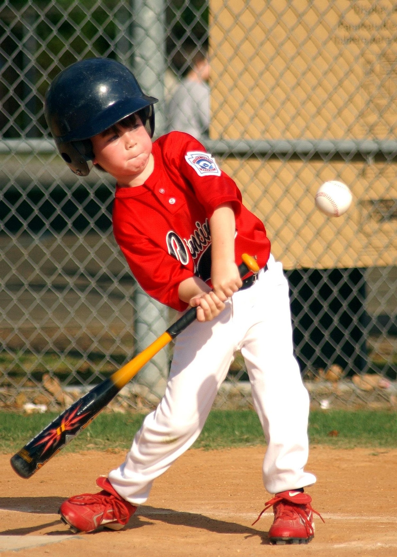 A batter is at home plate, ready to swing.
