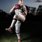 A pitcher is winding up, prior to release.