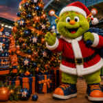 Orbit dressed as Santa in front of an Astros Christmas tree and ugly sweater.