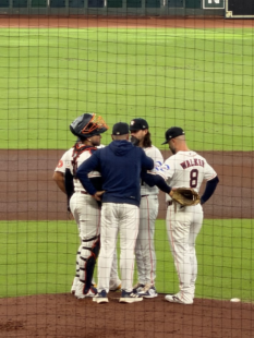 A conference on the pitcher's mound at Daikin Park.