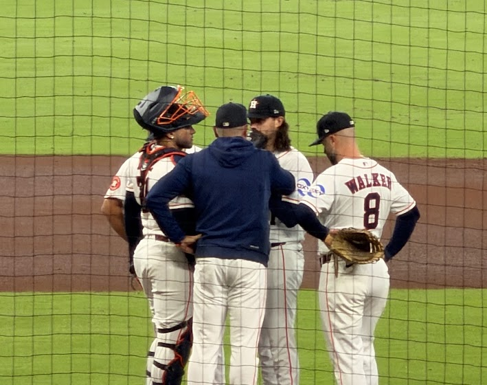 A conference on the pitcher's mound at Daikin Park.