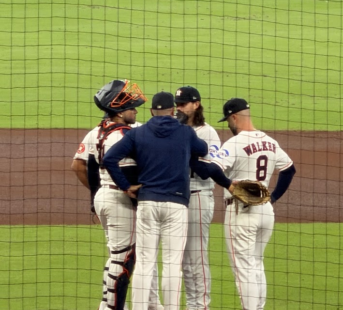 A conference on the pitcher's mound at Daikin Park.