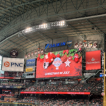 Christmas in July is splashed across the screen at Daikin Park.