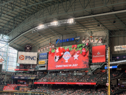 Christmas in July is splashed across the screen at Daikin Park.