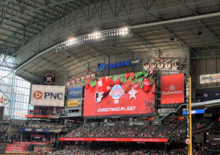 Christmas in July is splashed across the screen at Daikin Park.