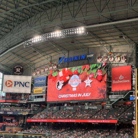 Christmas in July is splashed across the screen at Daikin Park.