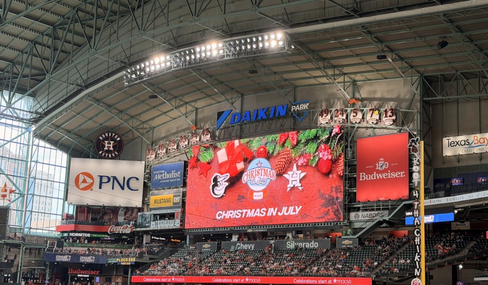 Christmas in July is splashed across the screen at Daikin Park.
