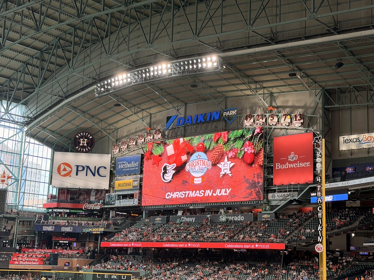 Christmas in July is splashed across the screen at Daikin Park.