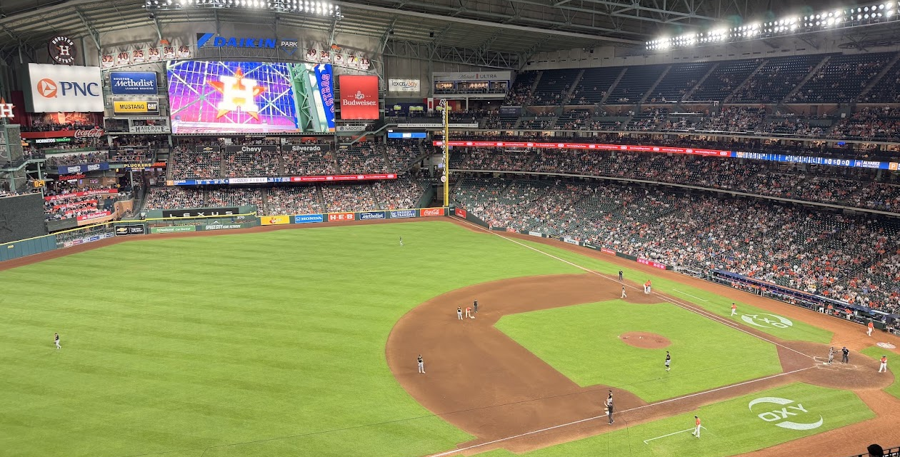 The Astros are on the field at Daikin Park.