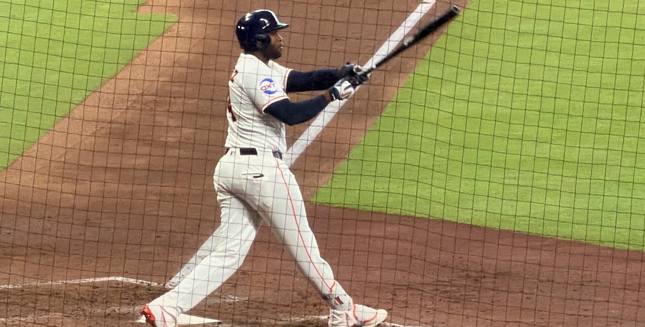 Yordan Alvarez swings the bat at Daikin Park.