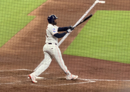 Yordan Alvarez swings the bat at Daikin Park.