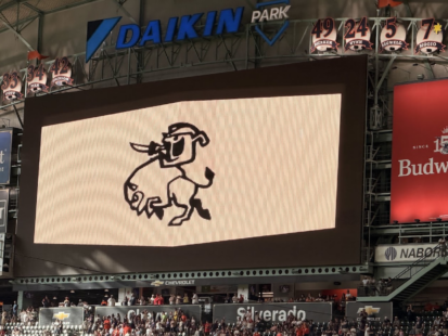 Charge graphic featuring a cowboy riding a charging bull on the Daikin Park scoreboard.