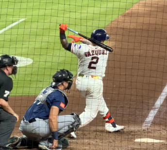 Houston Astros catcher Christian Vázquez follows through on a swing against the Seattle Mariners at Daikin Park.
