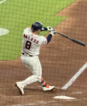 Christian Walker follows through on a swing during an Astros game at Daikin Park in 2026.