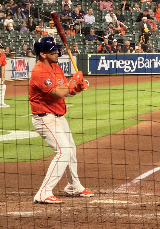 Isaac Paredes holds his bat at the plate during an Astros game at Daikin Park.