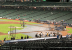 Houston Astros players gather near the batting cage before a game at Daikin Park.