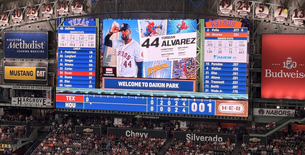 Daikin Park scoreboard displays Yordan Alvarez's Marvel Night graphic during an Astros game against the Rangers.