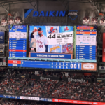 Daikin Park scoreboard displays Yordan Alvarez's Marvel Night graphic during an Astros game against the Rangers.