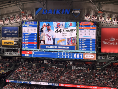 Daikin Park scoreboard displays Yordan Alvarez's Marvel Night graphic during an Astros game against the Rangers.