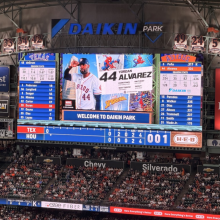 Daikin Park scoreboard displays Yordan Alvarez's Marvel Night graphic during an Astros game against the Rangers.