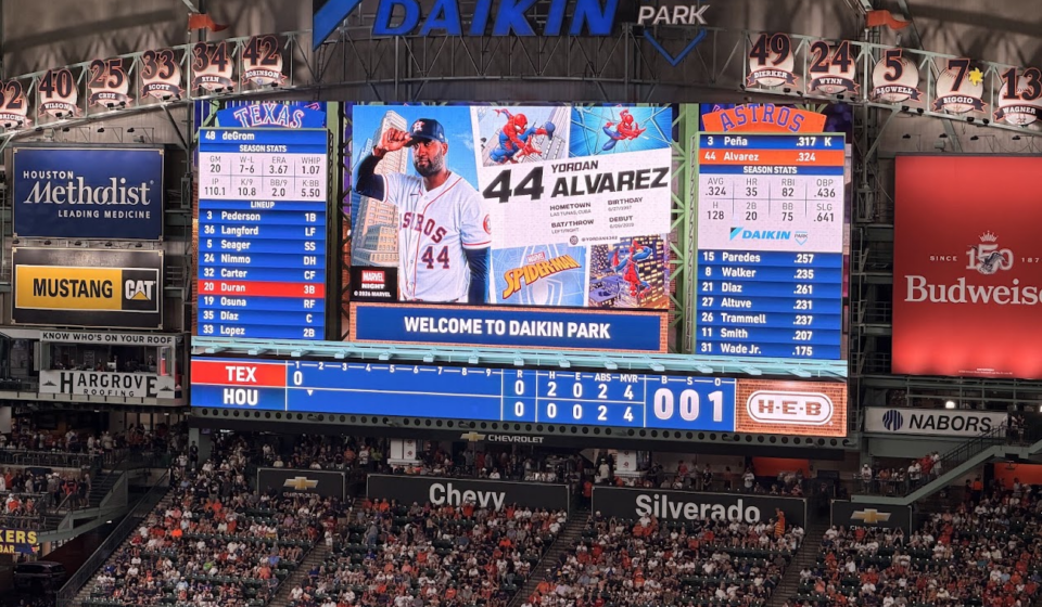 Daikin Park scoreboard displays Yordan Alvarez's Marvel Night graphic during an Astros game against the Rangers.